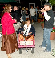 Guy explaining something to Connie in the wagon